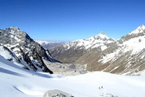 Jagged peaks above mountain meadows.